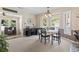 Dining area featuring a round table with chairs, with an open concept view of an adjacent bar area at 1575 Victoria Ln., Myrtle Beach, SC 29577