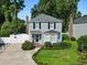 Charming two-story home with blue siding, black shutters, and a well-manicured front yard at 1575 Victoria Ln., Myrtle Beach, SC 29577