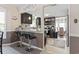 Open concept with bar stool seating at kitchen counter. Shows sink and overhead lighting at 1575 Victoria Ln., Myrtle Beach, SC 29577