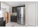 Stainless steel refrigerator, dark cabinets and marble countertops in a well lit kitchen at 1575 Victoria Ln., Myrtle Beach, SC 29577
