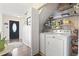 Functional laundry room with modern washer and dryer, offering convenience and ample storage space at 1575 Victoria Ln., Myrtle Beach, SC 29577