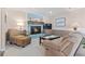 Cozy living room featuring a fireplace with blue brick and comfortable seating, perfect for relaxation at 1575 Victoria Ln., Myrtle Beach, SC 29577