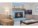 Inviting living room with a blue brick fireplace, creating a warm and comfortable gathering space at 1575 Victoria Ln., Myrtle Beach, SC 29577
