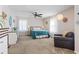 Spacious primary bedroom featuring a ceiling fan, plush carpeting and large windows for natural light at 1575 Victoria Ln., Myrtle Beach, SC 29577
