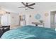 Comfortable primary bedroom with ceiling fan, dresser, closet, and ample natural light at 1575 Victoria Ln., Myrtle Beach, SC 29577