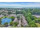 Scenic community view featuring lush landscaping, a tranquil pond, and a glimpse of the ocean in the distance at 158 Palisade Loop # 158, Pawleys Island, SC 29585