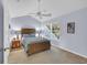 A comfy bedroom features vaulted ceilings, a queen bed, lamps, and a window at 158 Palisade Loop # 158, Pawleys Island, SC 29585