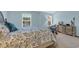 Bright bedroom featuring two windows, a queen-sized bed, and a TV on top of a dresser at 158 Palisade Loop # 158, Pawleys Island, SC 29585