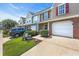 Beautiful townhomes with brick accents, well-kept lawns and individual garages at 158 Palisade Loop # 158, Pawleys Island, SC 29585