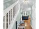 Hallway with wooden floors, staircase, and accent bench at 158 Palisade Loop # 158, Pawleys Island, SC 29585