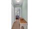 Hallway view leading to a bedroom with a ceiling fan and windows at 158 Palisade Loop # 158, Pawleys Island, SC 29585