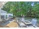 Outdoor patio setting with seating area, fire pit, and well-maintained landscaping at 158 Palisade Loop # 158, Pawleys Island, SC 29585