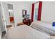 Cozy bedroom with twin beds, dark wood accents, and patterned curtains at 160 Lazy Willow Ln. # 202, Myrtle Beach, SC 29588