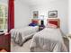 Bright bedroom featuring two twin beds, neutral carpet, and natural light at 160 Lazy Willow Ln. # 202, Myrtle Beach, SC 29588