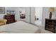 Bedroom featuring dark wood furniture, a comfortable bed, and serene lighting at 160 Lazy Willow Ln. # 202, Myrtle Beach, SC 29588