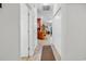 Bright hallway featuring tile flooring, white walls, and access to multiple rooms with closet for optimal storage at 160 Lazy Willow Ln. # 202, Myrtle Beach, SC 29588