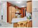 Efficient kitchen with warm wood cabinetry, neutral countertops, and modern appliances at 160 Lazy Willow Ln. # 202, Myrtle Beach, SC 29588