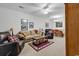 Cozy living room with comfortable seating, neutral carpet, decorative accents, and adjacent dining area at 160 Lazy Willow Ln. # 202, Myrtle Beach, SC 29588