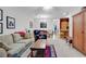 Open-concept living area with casual seating, dining space, light-filled, and wooden cabinets at 160 Lazy Willow Ln. # 202, Myrtle Beach, SC 29588