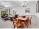Bright living area with slider door access to deck and flexible dining area featuring a wooden table at 160 Lazy Willow Ln. # 202, Myrtle Beach, SC 29588