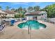 Community pool surrounded by lounge chairs and a white picket fence at a condo complex, perfect for relaxation at 160 Lazy Willow Ln. # 202, Myrtle Beach, SC 29588