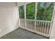Inviting screened porch with view of lush greenery at 160 Lazy Willow Ln. # 202, Myrtle Beach, SC 29588