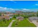 Overhead view of neighborhood home with tidy landscaping and nearby commercial buildings at 175 Cypress Ln., Little River, SC 29566