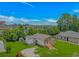 Aerial view of charming home, showing well-maintained yard, metal roof, shed, and proximity to other houses at 175 Cypress Ln., Little River, SC 29566
