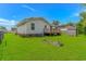 Large, grassy backyard with deck, shed, and a small garden at 175 Cypress Ln., Little River, SC 29566