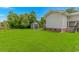 Well-maintained backyard featuring a storage shed and wooden deck with stairs at 175 Cypress Ln., Little River, SC 29566