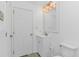 Clean and bright bathroom featuring a white vanity and modern lighting fixture at 175 Cypress Ln., Little River, SC 29566