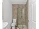 Modern bathroom featuring a tiled shower with glass door and sleek fixtures at 175 Cypress Ln., Little River, SC 29566