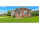 Charming brick home with a well-manicured lawn and inviting front entrance at 175 Cypress Ln., Little River, SC 29566