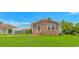 Charming brick home with a well-manicured lawn, inviting curb appeal, and a cozy entrance at 175 Cypress Ln., Little River, SC 29566