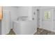 Bright laundry room with modern appliances and access to the outdoors at 175 Cypress Ln., Little River, SC 29566