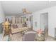 Cozy living room features neutral tones, stylish furniture, and a decorative ceiling fan at 175 Cypress Ln., Little River, SC 29566