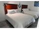 Bright bedroom featuring two beds with white linens and wood headboards at 201 S Ocean Blvd. # 408, Myrtle Beach, SC 29577