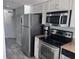 Kitchen area featuring stainless steel appliances, granite countertops, and ample storage at 201 S Ocean Blvd. # 408, Myrtle Beach, SC 29577