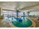 Indoor lazy river with palm tree accents, perfect for relaxation and enjoying a tropical-themed swimming experience at 201 S Ocean Blvd. # 408, Myrtle Beach, SC 29577