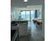 Living room showing ocean view, kitchenette, couch, chairs and dining table at 201 S Ocean Blvd. # 408, Myrtle Beach, SC 29577