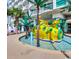 Outdoor water park with submarine, splash pad and palm trees, perfect for families with children at 201 S Ocean Blvd. # 408, Myrtle Beach, SC 29577