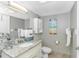 Cozy bathroom featuring granite countertop vanity, toilet, neutral colors, and beachy decor at 201 S Ocean Blvd. # 616, Myrtle Beach, SC 29577