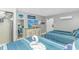Comfortable bedroom features two beds with striped bedding, TV, and closet at 201 S Ocean Blvd. # 616, Myrtle Beach, SC 29577