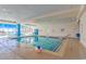 Inviting indoor pool area with lounge chairs, a beach view, and clear blue water at 201 S Ocean Blvd. # 616, Myrtle Beach, SC 29577
