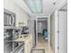 Galley kitchen featuring granite counters, stainless appliances, and access to the bedroom at 201 S Ocean Blvd. # 616, Myrtle Beach, SC 29577