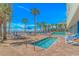 Community pool featuring a hot tub, palm trees, and plenty of lounge chairs at 201 S Ocean Blvd. # 616, Myrtle Beach, SC 29577
