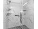 Modern glass enclosed shower with stylish marble-patterned tiles and mosaic flooring at 201 S Ocean Blvd. # 616, Myrtle Beach, SC 29577