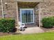 Brick patio featuring a chair and view of green lawn space at 207 Double Eagle Dr. # E-1, Surfside Beach, SC 29575