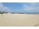 Picturesque beach with numerous sunbathers and colorful umbrellas at 207 Double Eagle Dr. # E-1, Surfside Beach, SC 29575