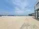 Expansive sandy beach near Surfside Pier on a sunny day at 207 Double Eagle Dr. # E-1, Surfside Beach, SC 29575